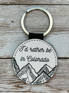 I'd Rather be in Colorado 2 Inch Round Leather Keychain
